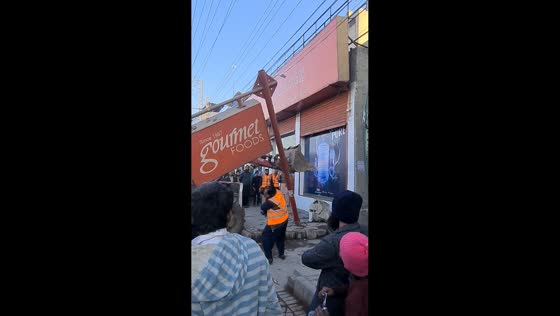 Backhoe accidentally taps pole and lightly injures worker in Sheikhupura, Pakistan