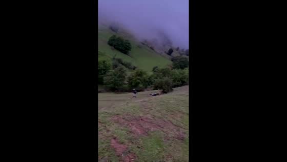 Motorcycle fails to climb steep hill in Sichuan, China