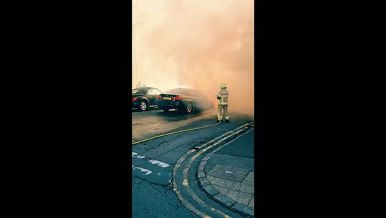 Car erupts in flames on a steep residential street in Swansea, Wales, UK