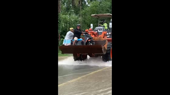 Floodwaters submerge roads, motorcycle carried by truck in Leyte, Philippines