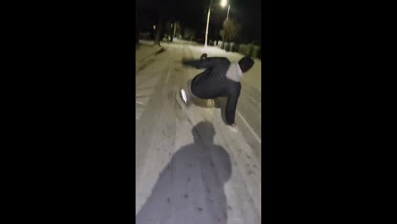 Guy slips and falls on icy street in Tipton, England