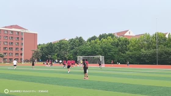 Player scores from set piece during football match in Jiangsu, China