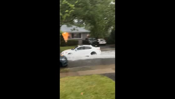 Storm leaves streets flooded as vehicles struggle through high water in Garwood, New Jersey