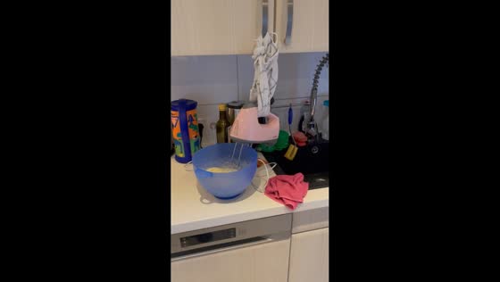 Woman demonstrates hands-free baking mixer hack in Tauberbischofsheim, Germany