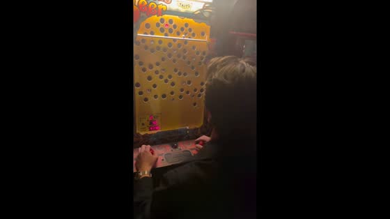 Man wins tricky arcade game Ice Cold Beer in Los Angeles, California, USA