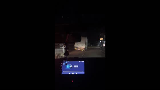 Truck nearly tips over while navigating a sharp bend on a road in the Philippines