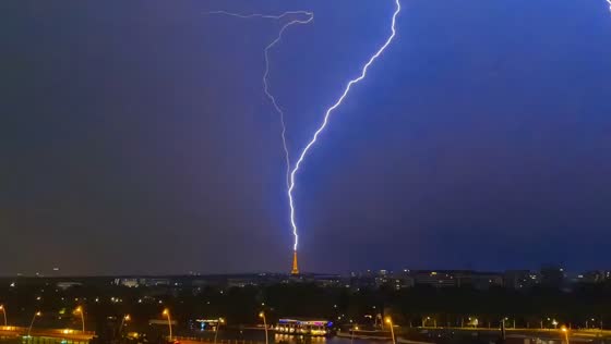 Lightning strikes Eiffel Tower during severe thunderstorm in Paris, France