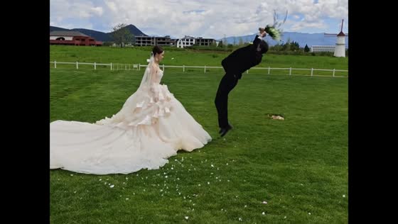 Groom falls onto grass after failed backflip in Yunnan, China