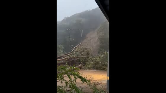 Landslide buries road and parking area after torrential rain in Sodegaura, Japan