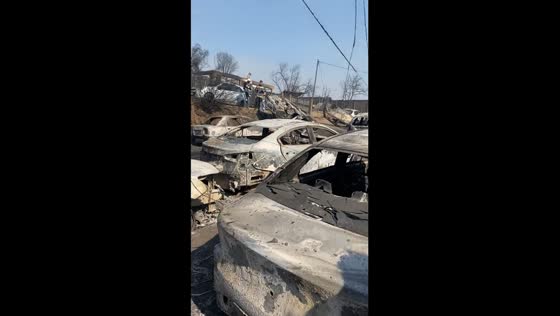Tragic aftermath: burnt cars litter highway as deadly forest fires engulf Villa Independencia
