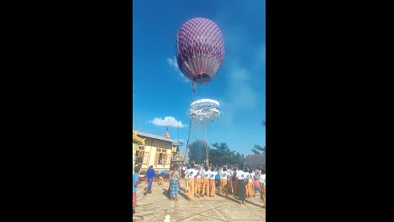 Hot air balloon flies in the sky during Myanmar's famous festival
