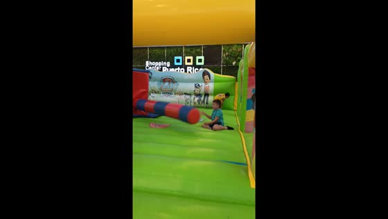 Kids playing on inflatable bouncy castle in Puerto Rico, Gran Canaria, Spain