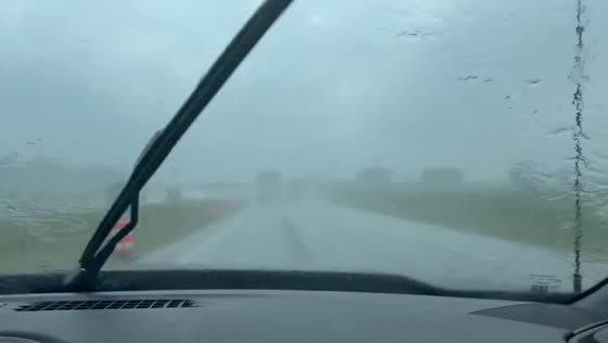 Blinding rain and mist cover windshield during storm in Jacksonburg, Indiana