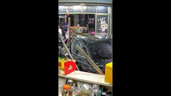 Car reverses into milk tea store causing major damage in Hainan, China
