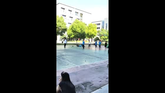 Student slips and falls after accidentally stepping on ball during basketball play in Hubei, China 