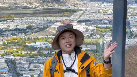 Man accidentally hits a pole while introducing the Potala Palace in Lhasa, Tibet, China