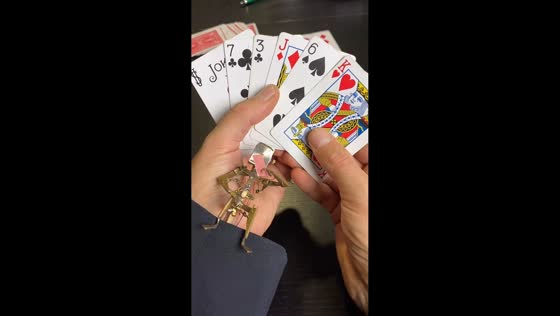 Intricate metal figurine showcased during card game in Barcelona, Spain