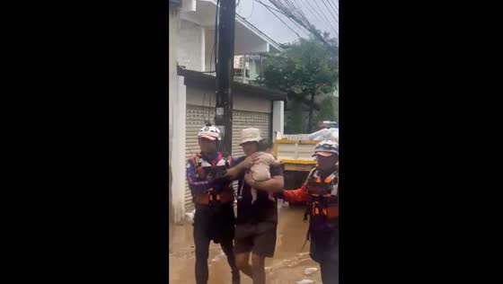 Infant rescued from flooded areas in Thailand following Typhoon Yagi