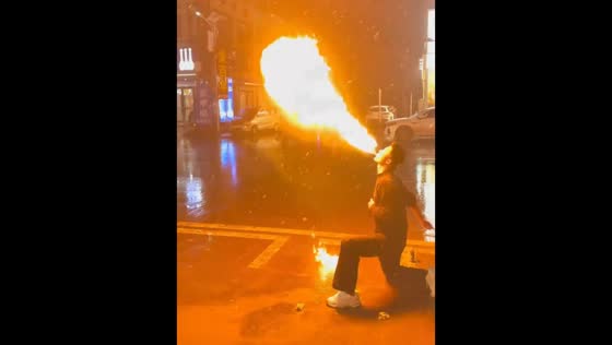 Fire-breathing performance on snowy street in Henan, China