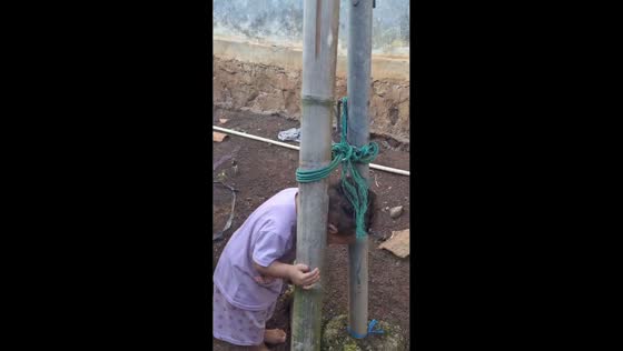 Toddler stuck between poles in Lampung, Indonesia