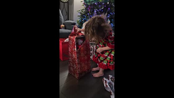 Toddler’s surprised reaction while opening Christmas gift in Waterford, Ireland