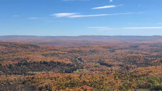 Peak autumn foliage paints panoramic forests from Copper Peak in Michigan, USA