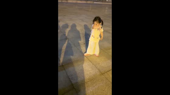 Dog puts paw on girl's head instead of her hand in Fujian, China