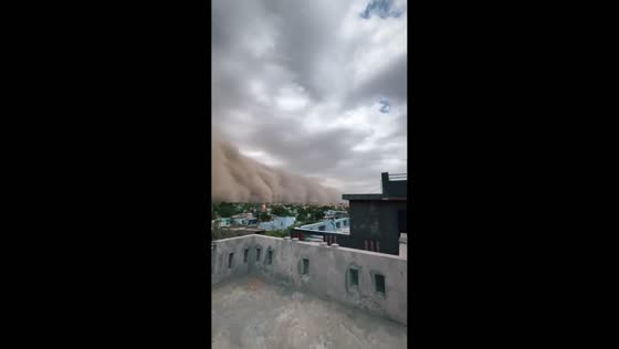Dust storm approaches rooftop in Maharawansar, Churu, India