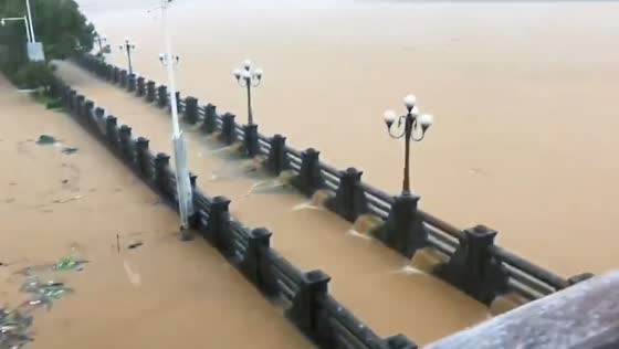 Severe flooding submerges riverside walkway at Moyang River, Guangdong, China