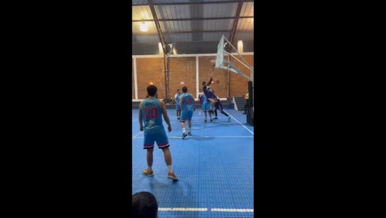 Glass shatters after dunk during basketball game in Cuenca, Ecuador