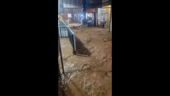 Flash floods leave muddy torrents flowing through streets in Xi'an, China