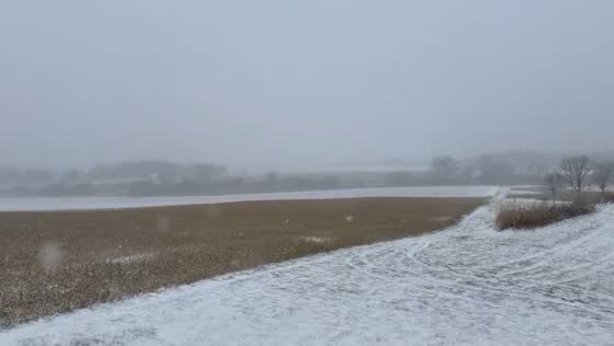 Heavy snowfall quickly covering the landscape in Waunakee, Wisconsin, USA