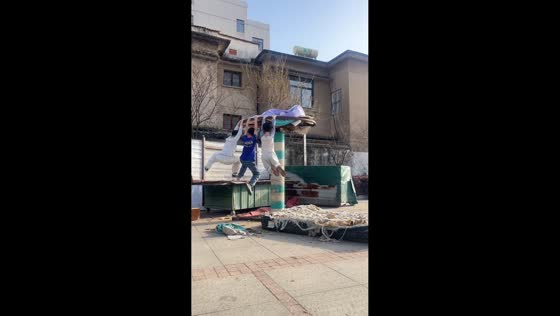 Boys play on spinning playground structure in Anhui, China