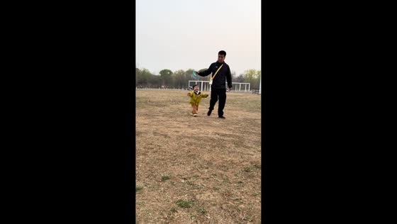 Kite reel flies away during playful moment between father and child in Hebei, China