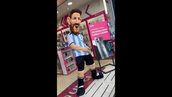 Person in Messi costume dances on Buenos Aires street