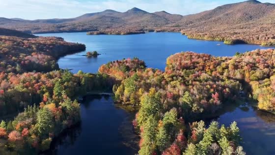 Autumn colors blanket lake from above in Vermont, USA