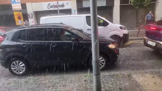 Heavy hailstorm batters vehicles and streets in Barcelona, Spain