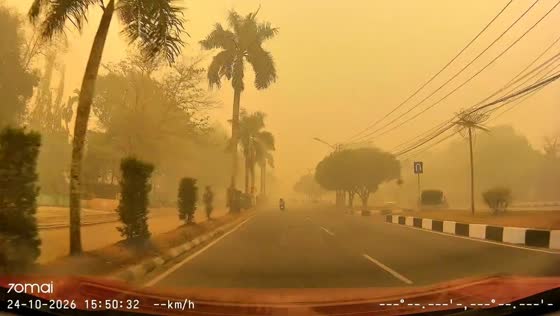 Thick smoke haze blankets Palangka Raya under a yellow-orange sky, Indonesia