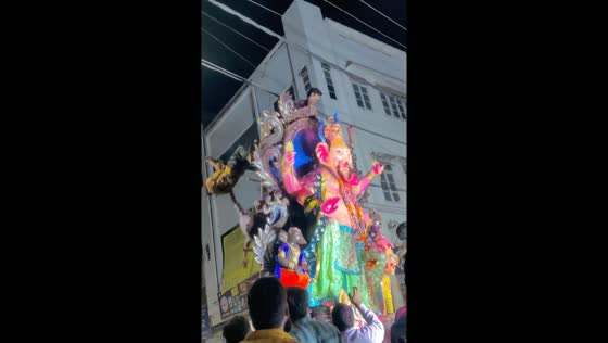 Two people fall from moving statue while attempting to clear cables