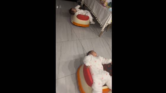 Twin daughters fall asleep on toy cars in Jiangsu Province, China