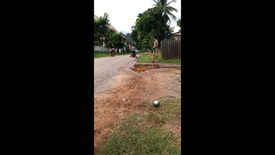 Person hit by motorcycle while walking in Batam, Indonesia