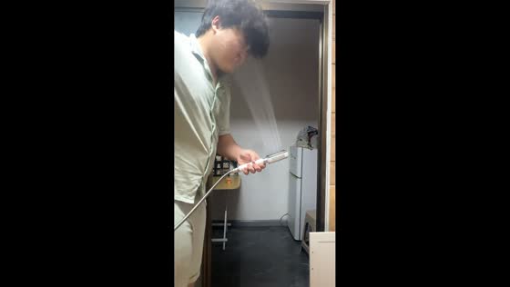 Man gets drenched while inspecting square rainfall shower head in Liaoning, China