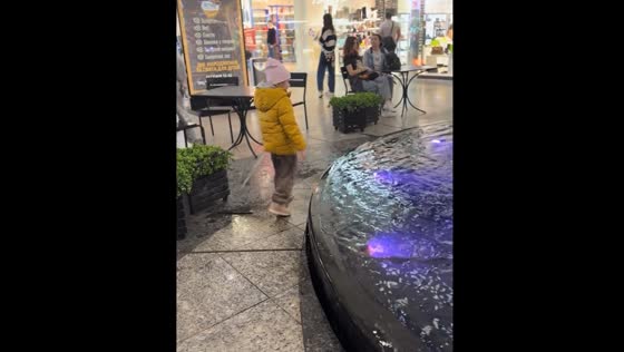 Child startled by sudden fountain jet in Dnipro, Ukraine