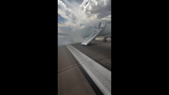 Landing gear fire prompts emergency evacuation at airport in Denver, Colorado