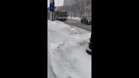 Snowy winter conditions along E Washington Ave in Minneapolis, USA