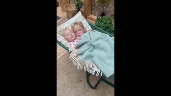 Kids nap in wheelbarrow: Hyltebruk, Sweden