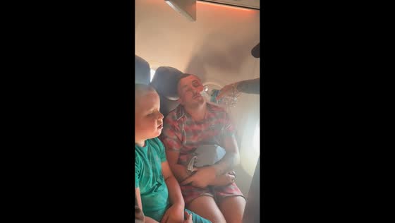 Family prank wakes father during flight in Swansea, Wales, UK