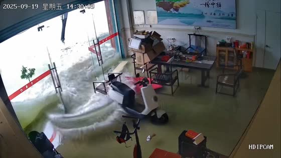 Flood waters break into office after heavy rains in Guangdong, China