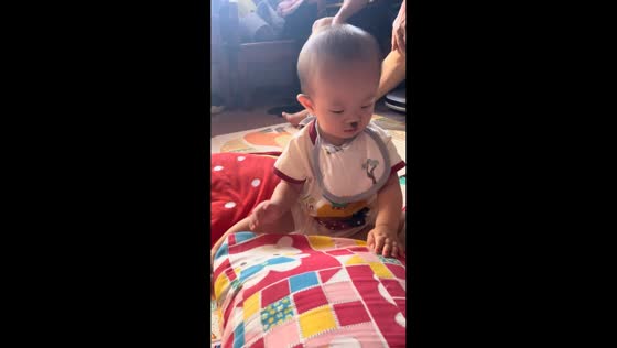 Food splatters on baby’s face during feeding in Guangdong, China
