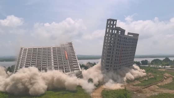 Unfinished high-rise demolished in controlled blast in Dandong, China